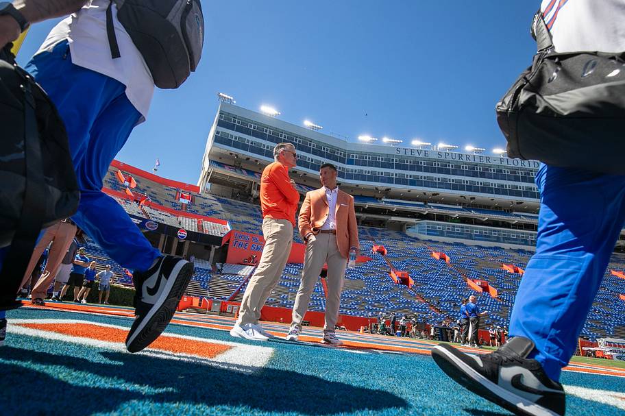 Florida athletic director Scott Stricklin, left, talks wth coach Jon Sumrall before their game against Mississippi.