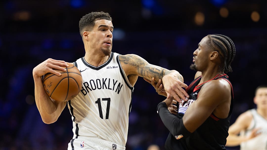 Dec 23, 2025; Philadelphia, Pennsylvania, USA; Brooklyn Nets forward Michael Porter Jr. (17) drives against Philadelphia 76ers guard Tyrese Maxey (0) during the first quarter at Xfinity Mobile Arena. Mandatory Credit: Bill Streicher-Imagn Images