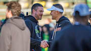 Oregon head coach Dan Lanning, left, and USC head coach Lincoln Riley shake hands before the game as the Oregon Ducks host the USC Trojans at Autzen Stadium in Eugene, Oregon.