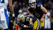 New Orleans Saints quarterback Derek Carr (4) prepares for a snap from center Erik McCoy (78) against the Carolina Panthers