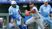 Mar 27, 2025; Kansas City, Missouri, USA; Kansas City Royals outfielder Dairon Blanco (44) is caught in a rundown by Cleveland Guardians third baseman Jose Ramirez (11) during the eighth inning at Kauffman Stadium. Mandatory Credit: Jay Biggerstaff-Imagn Images