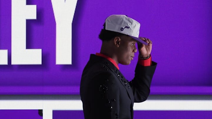 Jun 25, 2025; Brooklyn, NY, USA; Ace Bailey looks on after being selected as the fifth pick by the Utah in the first round of the 2025 NBA Draft at Barclays Center. Mandatory Credit: Brad Penner-Imagn Images Jun 25, 2025; Brooklyn, NY, USA; Ace Bailey looks on after being selected as the fifth pick by the Utah in the first round of the 2025 NBA Draft at Barclays Center. Mandatory Credit: Brad Penner-Imagn Images
