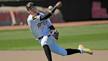 Wisconsin Timber Rattlers' Gregory Barrios (5) throws to first base against the Great Lakes Loons Wednesday, May 1, 2024, at Neuroscience Group Field at Fox Cities Stadium in Grand Chute, Wisconsin. The Great Lakes Loons won 9-8.