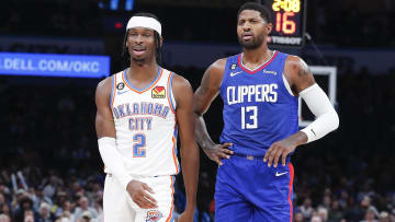 Oct 27, 2022; Oklahoma City, Oklahoma, USA; Oklahoma City Thunder guard Shai Gilgeous-Alexander (2) and LA Clippers guard Paul George (13) walks down the court during a time out during the first half at Paycom Center. Mandatory Credit: Alonzo Adams-USA TODAY Sports