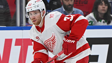 Oct 13, 2025; Toronto, Ontario, CAN; Detroit Red Wings left wing J.T. Compher (37) controls the puck in the third period against the Toronto Maple Leafs at Scotiabank Arena. Mandatory Credit: Gerry Angus-Imagn Images