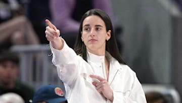 Aug 31, 2025; San Francisco, California, USA; Indiana Fever guard Caitlin Clark (center) gestures after an offensive foul by Golden State Valkyries guard Veronica Burton (foreground right) during the third quarter at Chase Center. Mandatory Credit: Darren Yamashita-Imagn Images