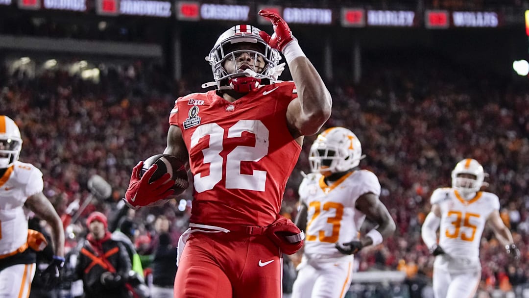 Ohio State Buckeyes running back TreVeyon Henderson (32) runs for a touchdown during the first half of the College Football Playoff first round game against the Tennessee Volunteers at Ohio Stadium in Columbus on Dec. 21, 2024.