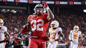 Ohio State Buckeyes running back TreVeyon Henderson (32) runs for a touchdown during the first half of the College Football Playoff first round game against the Tennessee Volunteers at Ohio Stadium in Columbus on Dec. 21, 2024.
