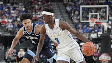 Nov 3, 2025; Las Vegas, Nevada, USA; BYU Cougars forward AJ Dybantsa (3) drives past Villanova Wildcats guard Tyler Perkins (4) during the first half of the Hall of Fame Series game at T-Mobile Arena. Mandatory Credit: Candice Ward-Imagn Images