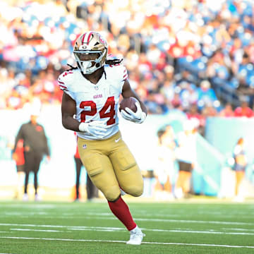 Aug 10, 2024; Nashville, Tennessee, USA;  San Francisco 49ers running back Jordan Mason (24) runs the ball against the Tennessee Titans during the first half at Nissan Stadium. Mandatory Credit: Steve Roberts-Imagn Images