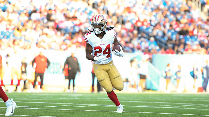 Aug 10, 2024; Nashville, Tennessee, USA;  San Francisco 49ers running back Jordan Mason (24) runs the ball against the Tennessee Titans during the first half at Nissan Stadium. Mandatory Credit: Steve Roberts-Imagn Images