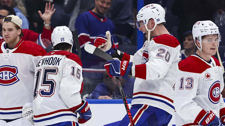 Apr 19, 2026; Tampa, Florida, USA; Montreal Canadiens forward Juraj Slafkovsky (20) celebrates scoring the game-winning goal with forward Alex Newhook (15) against the Tampa Bay Lightning during extra time in game one of the first round of the 2026 Stanley Cup Playoffs at Benchmark International Arena. Mandatory Credit: Morgan Tencza-Imagn Images