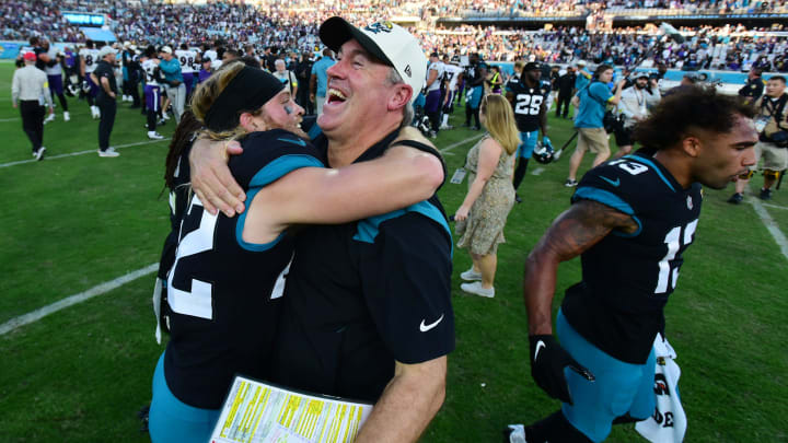 Jacksonville Jaguars head coach Doug Pederson celebrates with Jacksonville Jaguars safety Andrew Wingard.