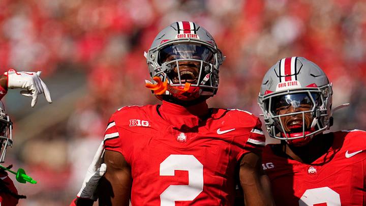 Ohio State Buckeyes safety Caleb Downs (2) celebrates an interception with cornerback Jermaine Mathews Jr. (7) abnd linebacker Sonny Styles (0) during the first half of the NCAA football game against the Grambling State Tigers at Ohio Stadium on Sept. 6, 2025.