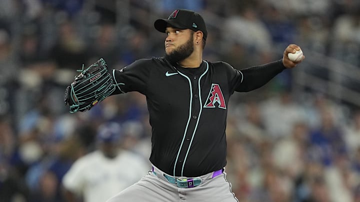Jun 18, 2025; Toronto, Ontario, CAN; Arizona Diamondbacks starting pitcher Eduardo Rodriguez (57) pitches to the Toronto Blue Jays during the first inning at Rogers Centre. Mandatory Credit: John E. Sokolowski-Imagn Images
