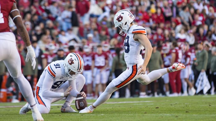 oNov 11, 2023; Fayetteville, Arkansas, USA;  Auburn Tigers place kicker Alex McPherson (38) kicks an