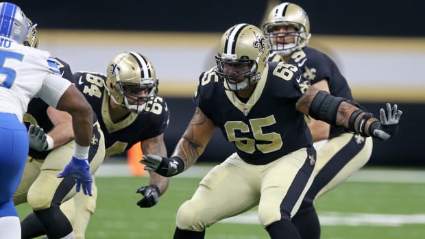 Oct 15, 2017; New Orleans Saints guard Senio Kelemete (65) blocks for quarterback Drew Brees (9) against the Detroit Lions 