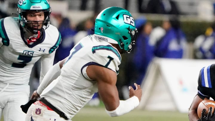 Ramsay s Jayden Martin runs the ball and is pursued by Gulf Shores' Jamichael Garrett (7) during the 5A AHSAA State Championship Game in Bryant-Denny Stadium Thursday, Dec. 7, 2023. Ramsay s Jayden Martin runs the ball and is pursued by Gulf Shores' Jamichael Garrett (7) during the 5A AHSAA State Championship Game in Bryant-Denny Stadium Thursday, Dec. 7, 2023.