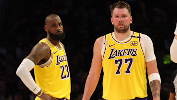 Feb 19, 2025; Los Angeles, California, USA; Los Angeles Lakers forward LeBron James (23) and guard Luka Doncic (77) during the second quarter against the Charlotte Hornets at Crypto.com Arena. Mandatory Credit: Jason Parkhurst-Imagn Images