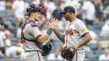 Atlanta Braves pitcher Raisel Iglesias celebrates with catcher Sean Murphy after recording save and defeating the New York Yankees 