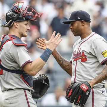 Atlanta Braves pitcher Raisel Iglesias celebrates with catcher Sean Murphy after recording save and defeating the New York Yankees 