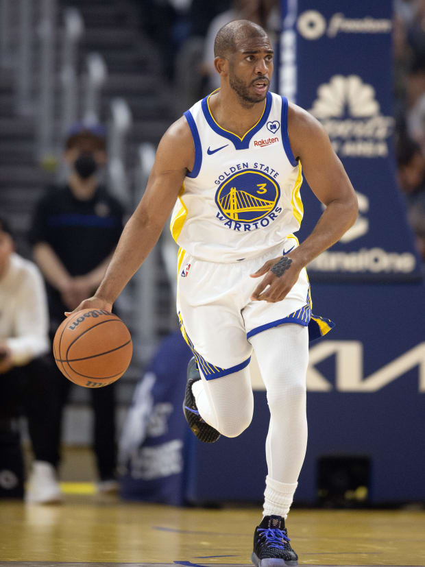 Golden State Warriors guard Chris Paul (3) brings the ball up court against the Utah Jazz. 