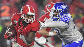 Oct 19, 2019; Athens, GA, USA; Georgia Bulldogs running back D'Andre Swift (7) runs against Kentucky Wildcats defensive tackle Kordell Looney (59) during the second half at Sanford Stadium. Mandatory Credit: Dale Zanine-Imagn Images