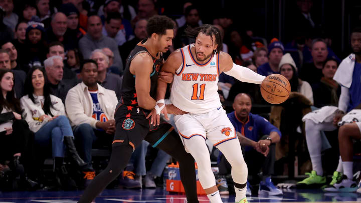 Jan 18, 2024; New York, New York, USA; New York Knicks guard Jalen Brunson (11) controls the ball against Washington Wizards guard Jordan Poole (13) during the fourth quarter at Madison Square Garden. Mandatory Credit: Brad Penner-USA TODAY Sports