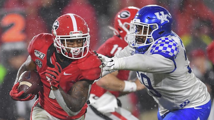 Oct 19, 2019; Athens, GA, USA; Georgia Bulldogs running back D'Andre Swift (7) runs against Kentucky Wildcats defensive tackle Kordell Looney (59) during the second half at Sanford Stadium. Mandatory Credit: Dale Zanine-Imagn Images