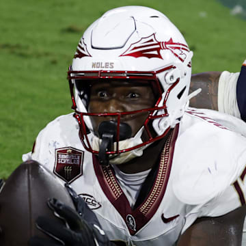 Sep 26, 2025; Charlottesville, Virginia, USA; Florida State Seminoles tight end Randy Pittman Jr. (13) reacts after catching a game tying touchdown pass in the final minute during the fourth quarter in front of Virginia Cavaliers linebacker Kam Robinson (5) during the fourth quarter at Scott Stadium. Mandatory Credit: Geoff Burke-Imagn Images