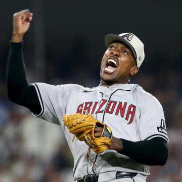 Jul 4, 2024; Los Angeles, California, USA; Arizona Diamondbacks pitcher Thyago Vieira (49) reacts after a strikeout to end the game against the Los Angeles Dodgers at Dodger Stadium. Mandatory Credit: Jason Parkhurst-USA TODAY Sports