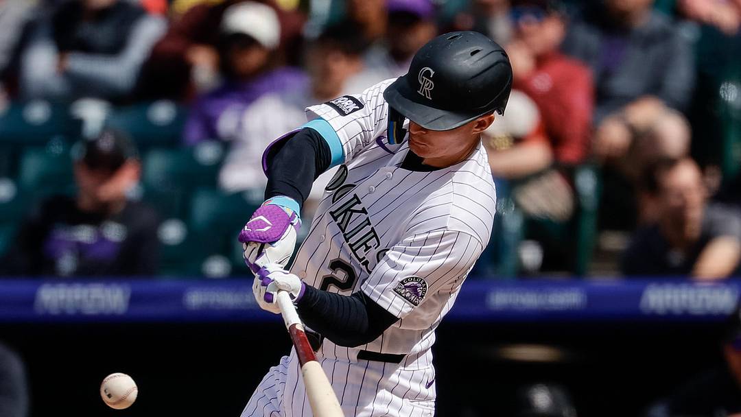 Colorado Rockies left fielder Mickey Moniak (22) hits a solo home run