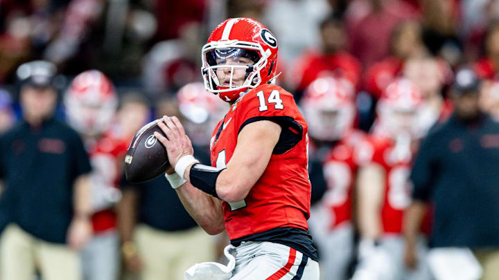 Jan 2, 2025; New Orleans, LA, USA;  Georgia Bulldogs quarterback Gunner Stockton (14) drops back to pass against against the Notre Dame Fighting Irish during the second half at Caesars Superdome. Mandatory Credit: Stephen Lew-Imagn Images