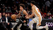 Apr 10, 2025; Brooklyn, New York, USA; Brooklyn Nets forward Jalen Wilson (22) brings the ball up court against Atlanta Hawks forward Zaccharie Risacher (10) during the second quarter at Barclays Center. Mandatory Credit: Brad Penner-Imagn Images
