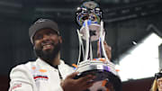 Jackson State Head Coach TC Taylor hoists the 2024 Cricket Celebration Bowl Trophy as the Tigers defeated South Carolina State 28-7 at Mercedes-Benz Stadium.  December 14, 2024; Credit: Kyle T. Mosley, HBCU Legends