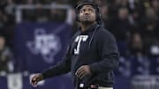 Dec 27, 2023; Houston, TX, USA; Texas A&M Aggies interim head coach Elijah Robinson looks up during the fourth quarter against the Oklahoma State Cowboys at NRG Stadium. Mandatory Credit: Troy Taormina-Imagn Images