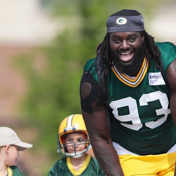 Green Bay Packers defensive lineman Nazir Stackhouse rides a bike to practice at training camp.