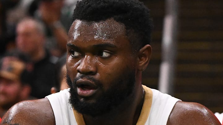 Zion Williamson #1 of the New Orleans Pelicans looks on from the bench against the Boston Celtics.