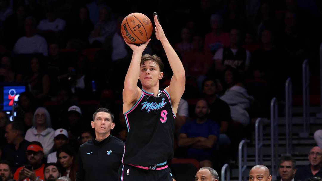 Mar 30, 2026; Miami, Florida, USA; Miami Heat guard Pelle Larsson (9) shoots the basketball against the Philadelphia 76ers during the second quarter at Kaseya Center. Mandatory Credit: Sam Navarro-Imagn Images