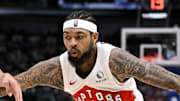 Toronto Raptors forward Brandon Ingram looks to move the ball to the basket past Dallas Mavericks forward Cooper Flagg.