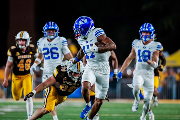 Keelan Marion scores a touchdown on a kickoff return against Wyoming