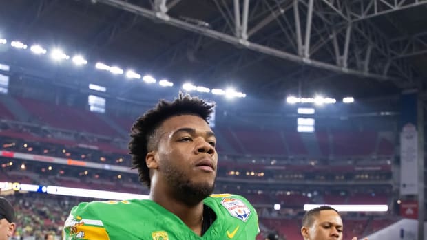 Jan 1, 2024; Glendale, AZ, USA; Oregon Ducks offensive lineman Ajani Cornelius (65) against the Liberty Flames during the 202