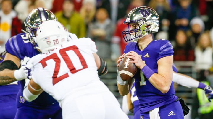 Then-Husky quarterback Sam Huard (7) goes up against Washington State during the first quarter of the 2021 Apple Cup.