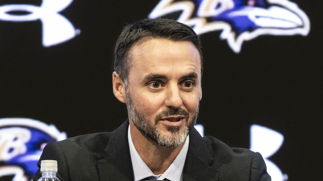 Jesse Minter smiling during opening remarks at press conference.