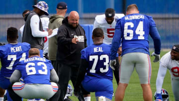 New York Giants head coach Brian Daboll greets offensive tackle Evan Neal (73) on day two of mandatory minicamp at the Giants training center on Wednesday, June 14, 2023, in East Rutherford.