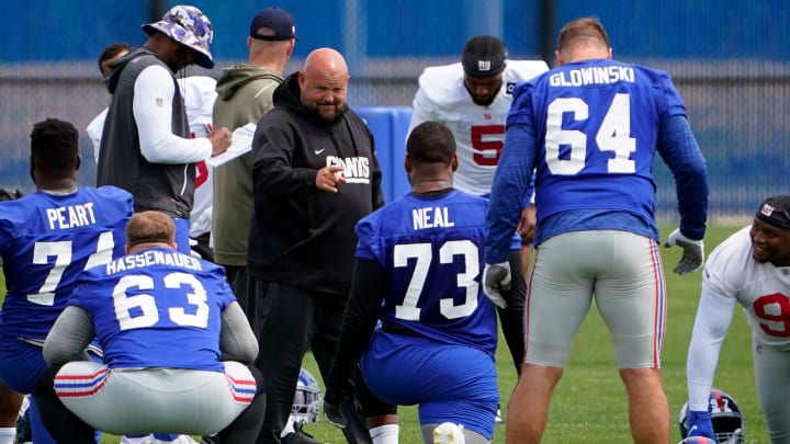 New York Giants head coach Brian Daboll greets offensive tackle Evan Neal (73) on day two of mandatory minicamp at the Giants training center on Wednesday, June 14, 2023, in East Rutherford.