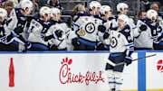 Mar 4, 2025; Elmont, New York, USA;  Winnipeg Jets defenseman Josh Morrissey (44) greets his teammates after scoring a goal in the second period against the New York Islanders at UBS Arena. Mandatory Credit: Wendell Cruz-Imagn Images