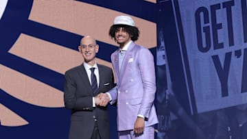 Jun 25, 2025; Brooklyn, NY, USA;  Asa Newell stands with NBA commissioner Adam Silver after being selected as the 23rd pick by the New Orleans Pelicans in the first round of the 2025 NBA Draft at Barclays Center. Mandatory Credit: Brad Penner-Imagn Images