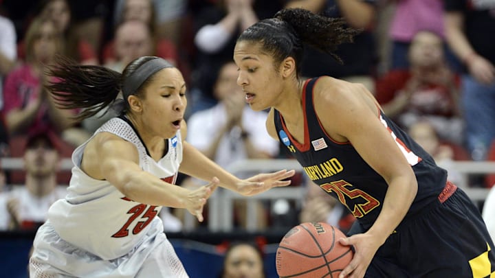 Apr 1, 2014; Louisville, KY, USA; Maryland Terrapins forward Alyssa Thomas (25) dribbles against Louisville Cardinals guard Tia Gibbs (25) in the finals of the Louisville regional in the 2014 NCAA Tournament at KFC YUM! Center. Mandatory Credit: Jamie Rhodes-Imagn Images
