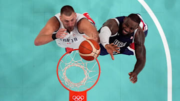  Serbia power forward Nikola Jokic and United States guard Lebron James jump for a rebound.
